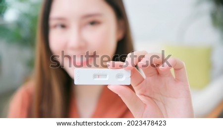 Similar – Image, Stock Photo Covid 19 antigen self test for nasal swab with positive result. Antigen test kit for home use to detection coronavirus infection. Negative test result from rapid antigen test. Coronavirus diagnosis.