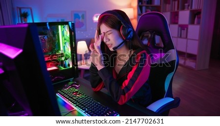 Similar – Image, Stock Photo Unhappy girl playing video game in evening time