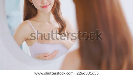 Similar – Image, Stock Photo Sick woman checking body temperature near window at home