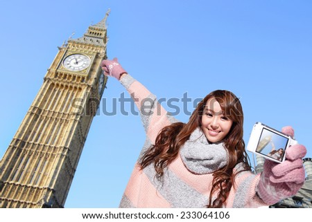 Happy woman tourist travel in london and photo selfie by camera with Big Ben in United Kingdom, uk