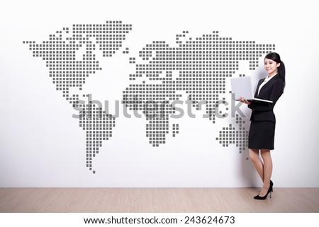 Global business concept - business woman using laptop computer with world map