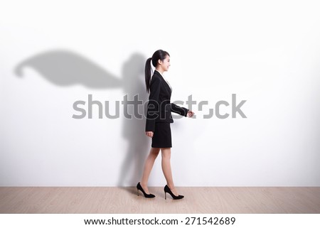 Successful Superhero business woman walking with white wall background, asian
