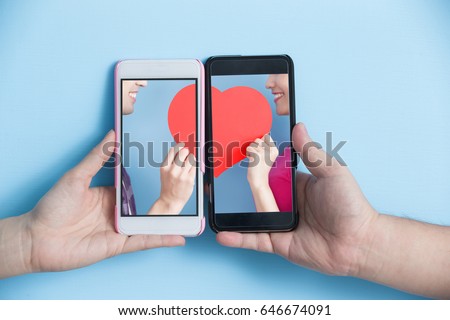 Similar – Image, Stock Photo Young couple taking a selfie while kissing in the mountains