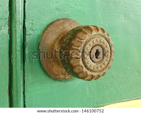 Vintage door knob on old wooden door