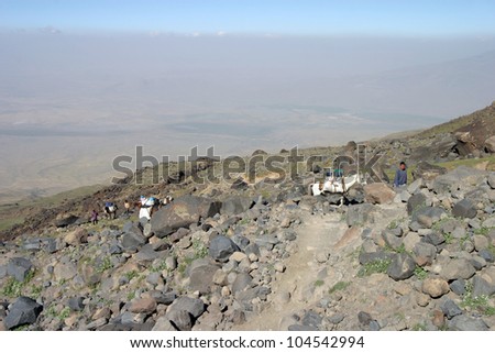 MOUNT AGRI, TURKEY - AUGUST 18: Porters and horses climbing to 4200 meters camp, August 18, 2008 in Agri, Turkey. Mount Agri is the highest mountain in Turkey and  believed that Noah Ark is there.