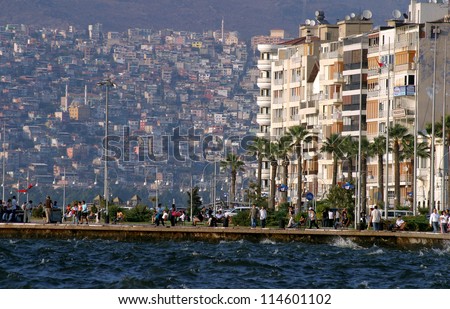 IZMIR, TURKEY - JUNE 26: People walking around at Alsancak coastline in city of Izmir, June 26, 2005 in Izmir, Turkey. Izmir is the third most populous city in Turkey.