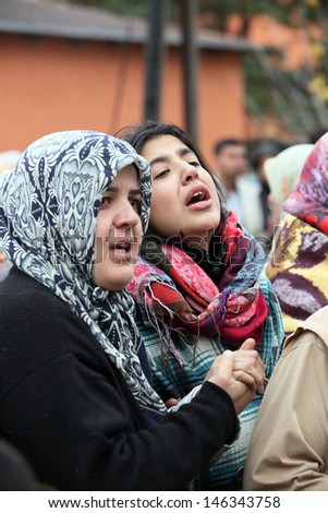 VAN, TURKEY - OCTOBER 25: Turkish women crying in front of our house on October 25, 2011 in Van, Turkey. It is 604 killed and 4152 injured in Van Earthquake.
