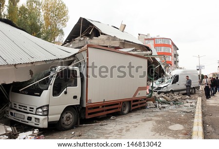 VAN, TURKEY - OCTOBER 25: Buildings and truck ruined during the earthquake of Van-Ercis on October 25, 2011 in Van, Turkey. It is 604 killed and 4152 injured in Van-Ercis Earthquake.