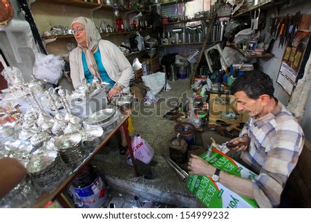 HATAY, TURKEY - AUGUST 21: Turkish woman shopping in historical place \'Uzun Carsi\', on August 21, 2011 in Hatay, Turkey. Uzun Carsi is oldest and one of the most important shopping certer in Hatay.