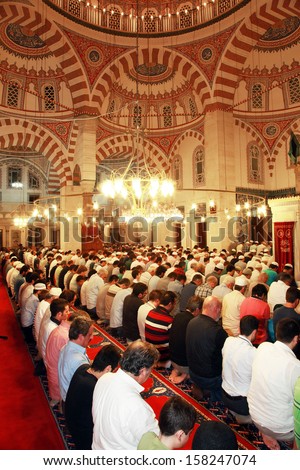 ISTANBUL, TURKEY - JUNE 23: People praying at Ramadan night in Validei Atik Mosque on June 23, 2013 in Istanbul, Turkey.