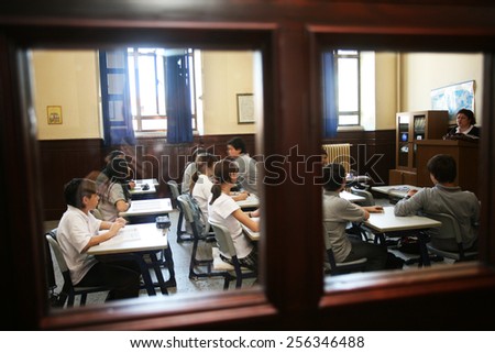 ISTANBUL, TURKEY - MAY 15: Turkish elementary school students attentively listening to teacher in the classroom on May 15, 2008 in Istanbul, Turkey.