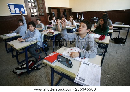 ISTANBUL, TURKEY - MAY 15: Turkish elementary school students attentively listening to teacher in the classroom on May 15, 2008 in Istanbul, Turkey.
