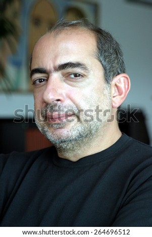 ISTANBUL, TURKEY - AUGUST 3: Turkish journalist, columnist and author Umur Talu portrait on August 3, 2005 in Istanbul, Turkey.
