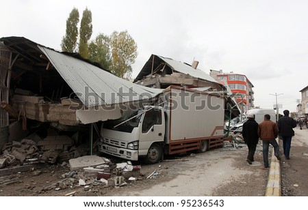 ERCIS, TURKEY-OCTOBER 25: Earthquake damage in Ercis, Van, Turkey. Destroyed house and truck after earthquake. October 25, 2011.