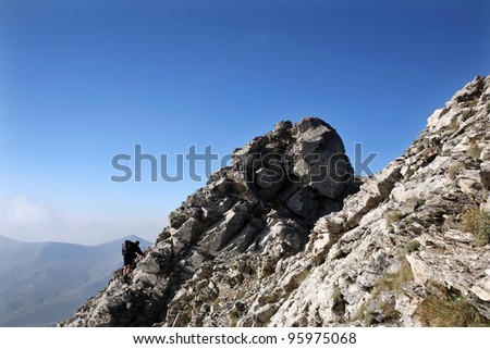 Climbing Mount Olympus. Mount Olympus is highest mountain in Greece at 2917 meters. (Mount Olympus is the home of the Twelve Olympians, the principal gods in the Greek pantheon)