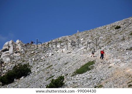 OLYMPUS, GREECE - AUGUST 14: People trekking in Mount Olympus on August 14, 2008 in Litohoro, Greece. Mount Olympus is the home of the Twelve Olympians, the principal gods in the Greek pantheon.