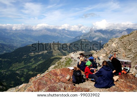 MONT BLANC, FRANCE - AUGUST 25: Family doing a picnic Nid d\'Aigle at 2386 meters on August 25, 2006 in Chamonix, France. Nid d\'Aigle Station is end of the Mont Blanc tramway.