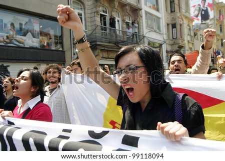 ISTANBUL, TURKEY - MAY 1: International Workers Day. Workers and socialist  group walks in Istiklal Street on May 1, 2007 in Istanbul, Turkey. The event attracted thousands of labor protesters.