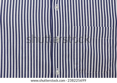 Blue stripe men's shirt texture with buttons and pocket; Close up