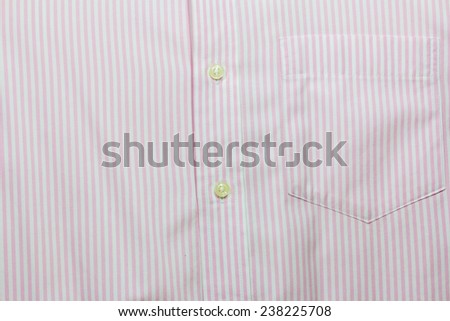 Pink stripe men\'s shirt texture with buttons and pocket; Close up