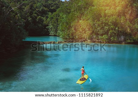 Similar – Image, Stock Photo Woman with boat standing in river