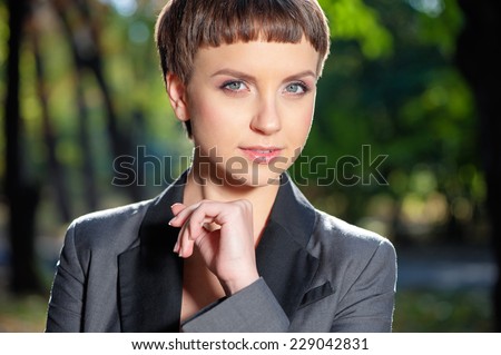 Confident beauty. Close up portrait of Confident young women looking at camera outdoors.