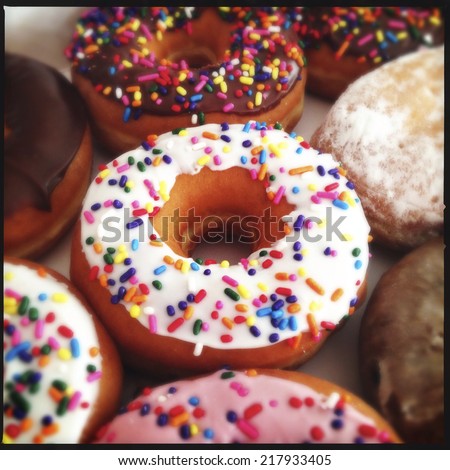 close up image of color donuts in a box