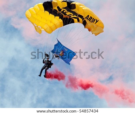 EAU CLAIRE, WI - JUNE 6: A closeup of a member of the U.S. Army Golden Knights parachute team on a descent with a Wisconsin State flag at the Chippewa Valley Airshow in Eau Claire, WI on June 6, 2010.