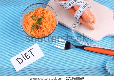 Carrot salad. Diet food, healthy food. Tasty and healthy. Grated carrots and greens.The concept of weight loss and a healthy diet.