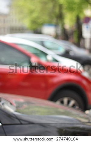 A number of the car. Blur, refocus, bokeh. A lot of cars in a row. To Park, drive. Cars in the city. On the street. Spring. Urban traffic.