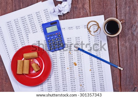 Start up, business, finance department. The concept of counting finance, accounting work. Office life. The failure, error. Calculator, waffles, good coffee, and documents.