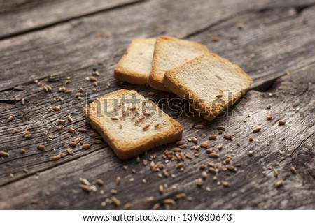Organic toast bread on a rustic wooden board