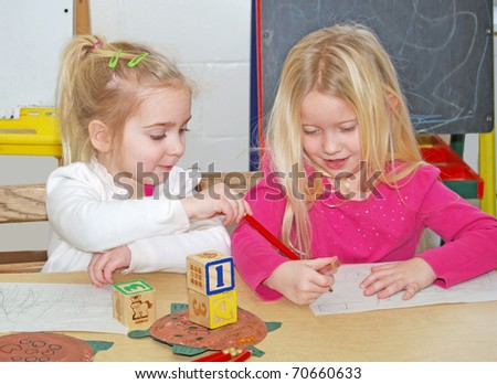 two preschoolers at work