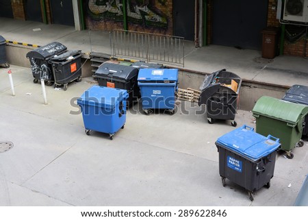 BERLIN, GERMANY - MAY 18, 2015: dumpsters on a backyard in the city center of Berlin