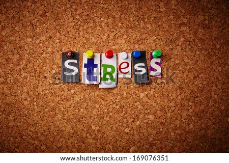 Stress - Cut out letters pinned on a notice board.
