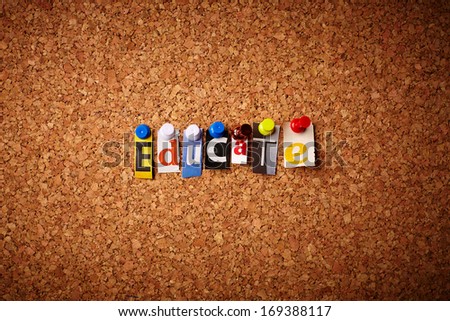 Educate   - Cut out letters pinned on a cork notice board.