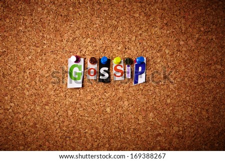 Gossip   - Cut out letters pinned on a cork notice board.