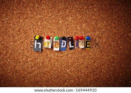 Headline - Cut out letters pinned on a cork notice board.