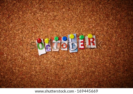 October - Cut out letters pinned on a cork notice board.