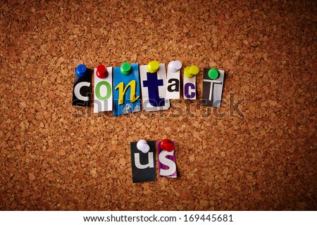 Contact us - Cut out letters pinned on a cork notice board.