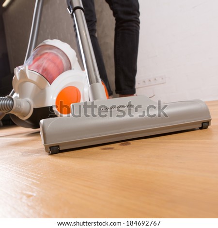 man who cleans the floor of the house
