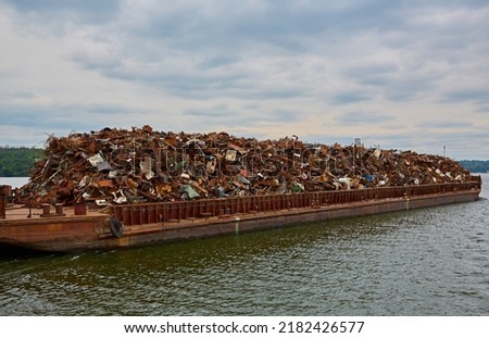 Transportation industry. Ship barge transports scrap metal and sand with gravel Imagine de stoc © 