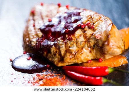 Deer steak with cranberries sauce. Selective focus.