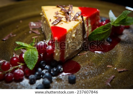Cheesecake with strawberry sauce, Blueberry and redcurrant