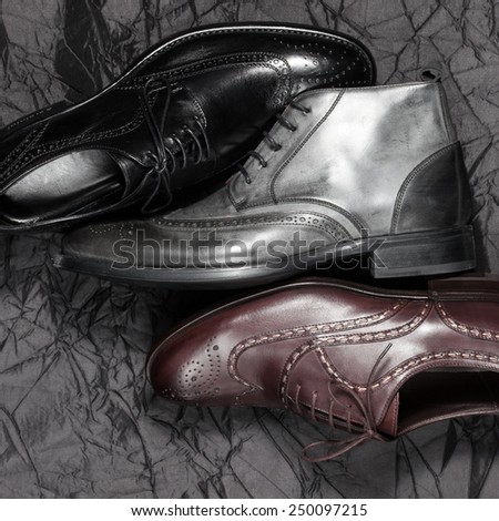 Set of trendy man footwear on a black background