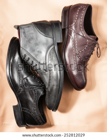 Set of trendy man footwear on a craft paper background