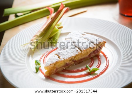 delicious rhubarb cake on white plate. sweet food