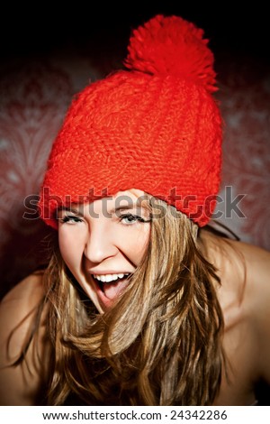 white hair young woman portrait in red cap, studio shot