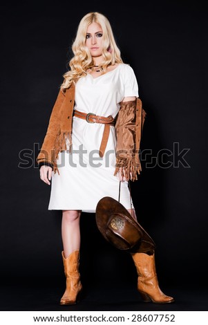 rodeo cowgirl in white dress, boots and cowboy hat