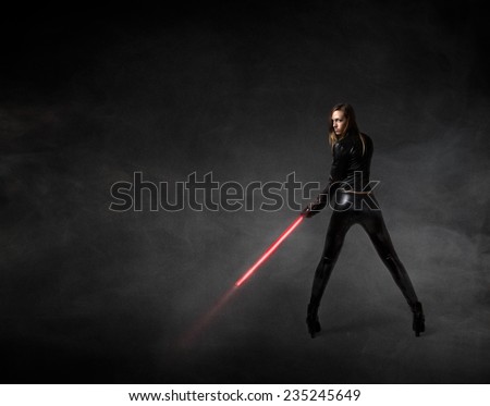 futuristic soldier with red laser sword